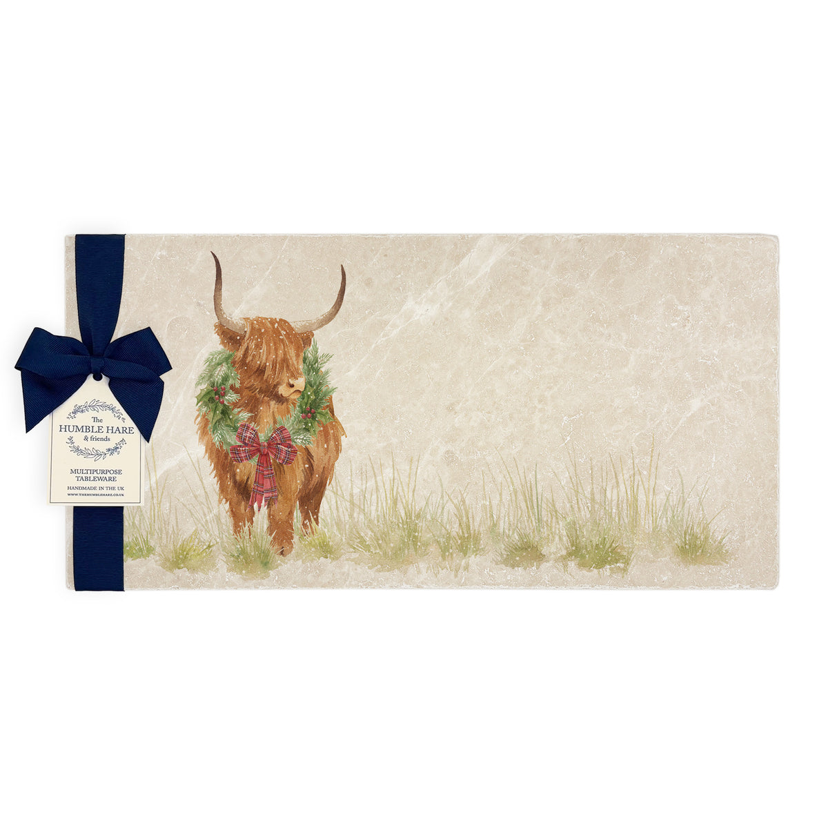 A rectangular marble sharing platter featuring a watercolour highland cow with a Christmas wreath and tartan bow around his neck. The marble platter is wrapped with a navy blue bow and paper tag.