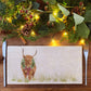 A rectangular marble sharing platter featuring a watercolour highland cow with a Christmas wreath and tartan bow around his neck.