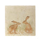 A large square cream multipurpose marble platter, featuring a watercolour design of two hares facing each other about to touch noses.