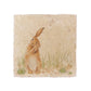 A medium square marble platter, featuring a wastercolour design of a hare washing his ear in the countryside.