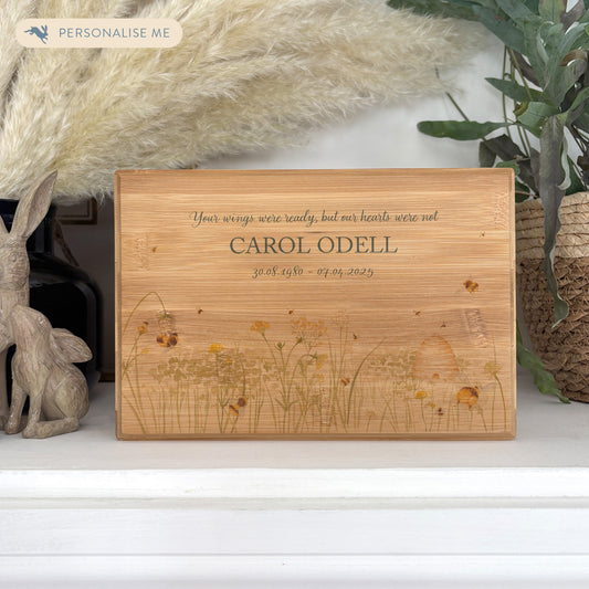 A beautifully crafted solid Bamboo wooden urn, finished with a soft watercolour design of a buzzy Bee flower meadow, Thoughtfully made for either display or burial, this personalised urn can be customised to create a meaningful memorial. Perfect for holding ashes of a loved one or a beloved pet, it serves as a comforting tribute and keepsake. 