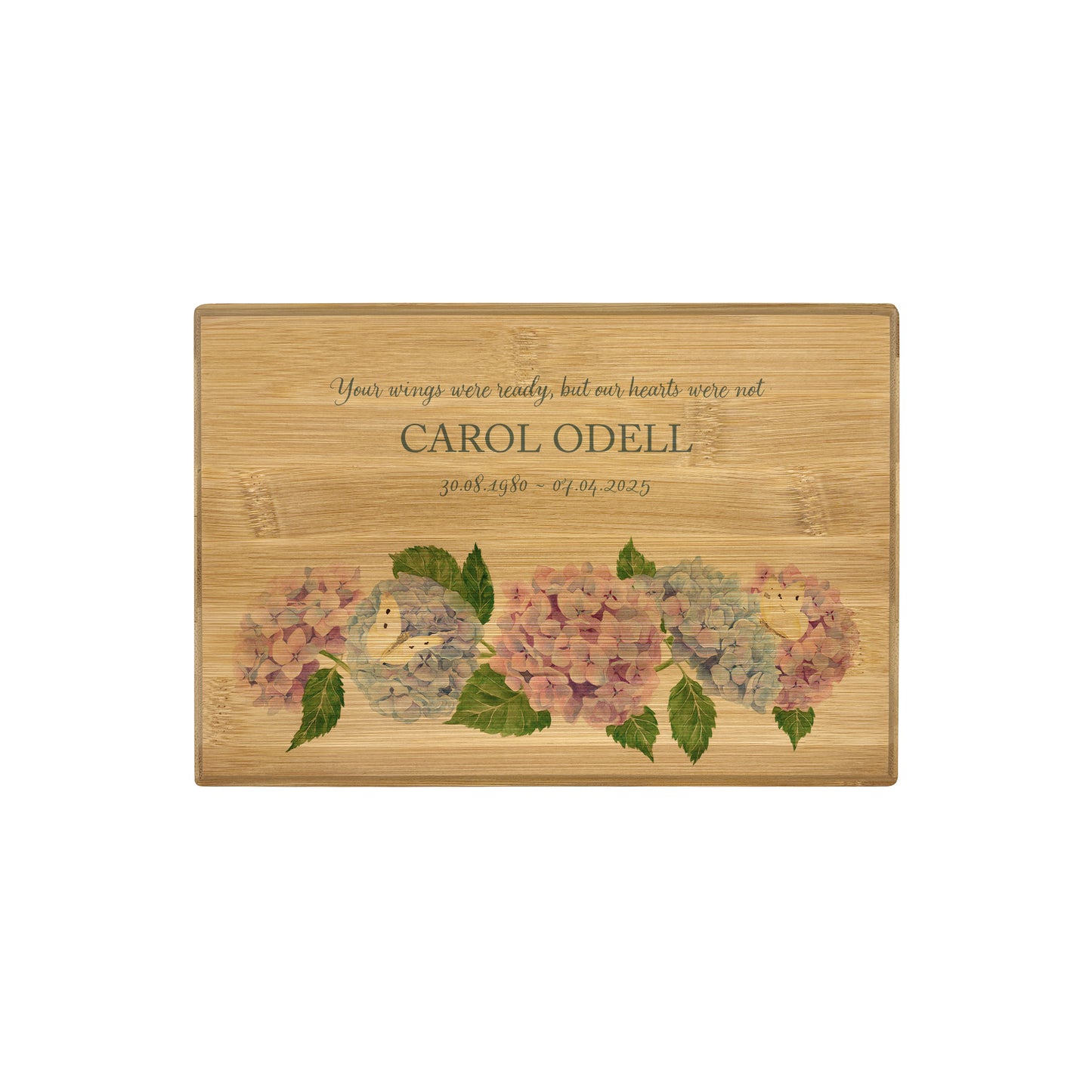 A beautifully crafted solid Bamboo wooden urn, personalised and finished with a soft watercolour design of Hydrangeas and butterflies for the person who loved flowers and being in the Garden. Thoughtfully made for either display or burial, this personalised urn can be customised to create a meaningful memorial. Perfect for holding ashes of a loved one or a beloved pet, it serves as a comforting tribute and keepsake. 
