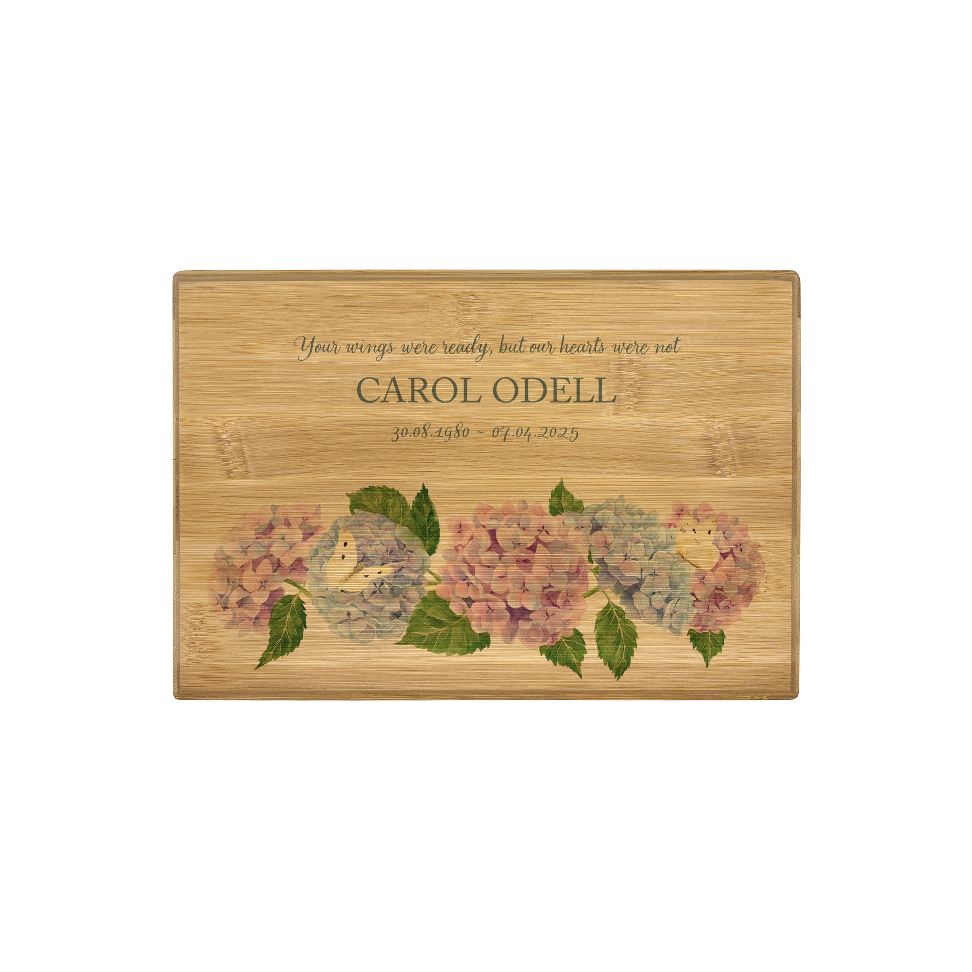 A beautifully crafted solid Bamboo wooden urn, personalised and finished with a soft watercolour design of Hydrangeas and butterflies for the person who loved flowers and being in the Garden. Thoughtfully made for either display or burial, this personalised urn can be customised to create a meaningful memorial. Perfect for holding ashes of a loved one or a beloved pet, it serves as a comforting tribute and keepsake. 