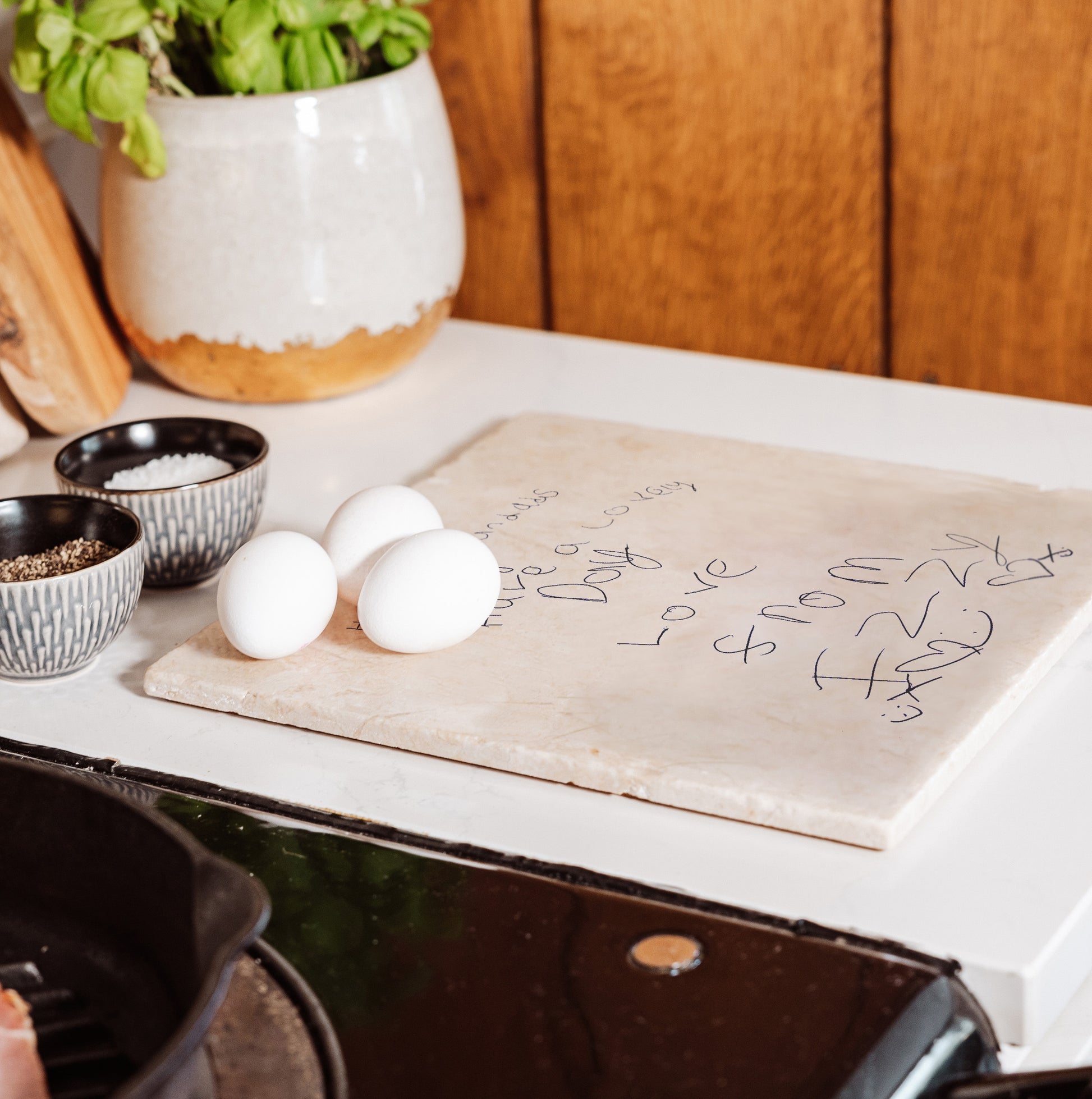 A large marble worktop saver and trivet with custom handwriting, ideal for grandparents and parents as a keepsake gift.