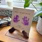 A bespoke medium marble picture tile featuring newborn handprints and measurements, a unique and meaningful gift for new parents.