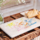 A child’s drawing on a custom marble platter, a personalised keepsake gift for parents and grandparents.