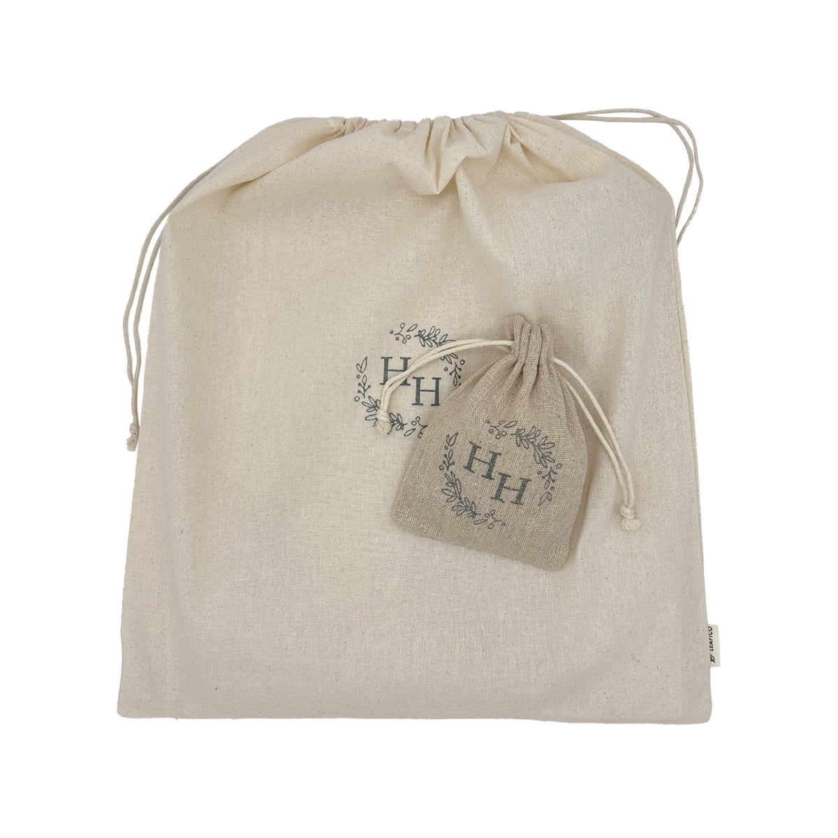 An eco-friendly large cotton board game bag with a smaller cotton bag to hold counters.