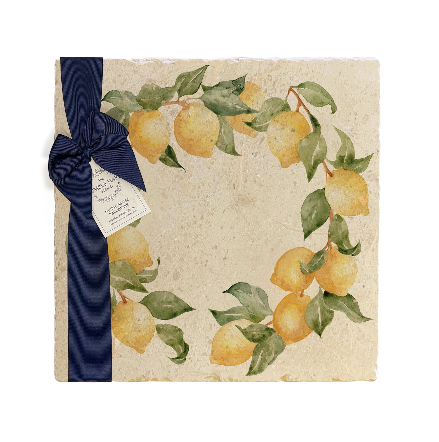 A large multipurpose marble platter with a watercolour lemon wreath design, packaged with a luxurious dark blue bow and branded gift tag.