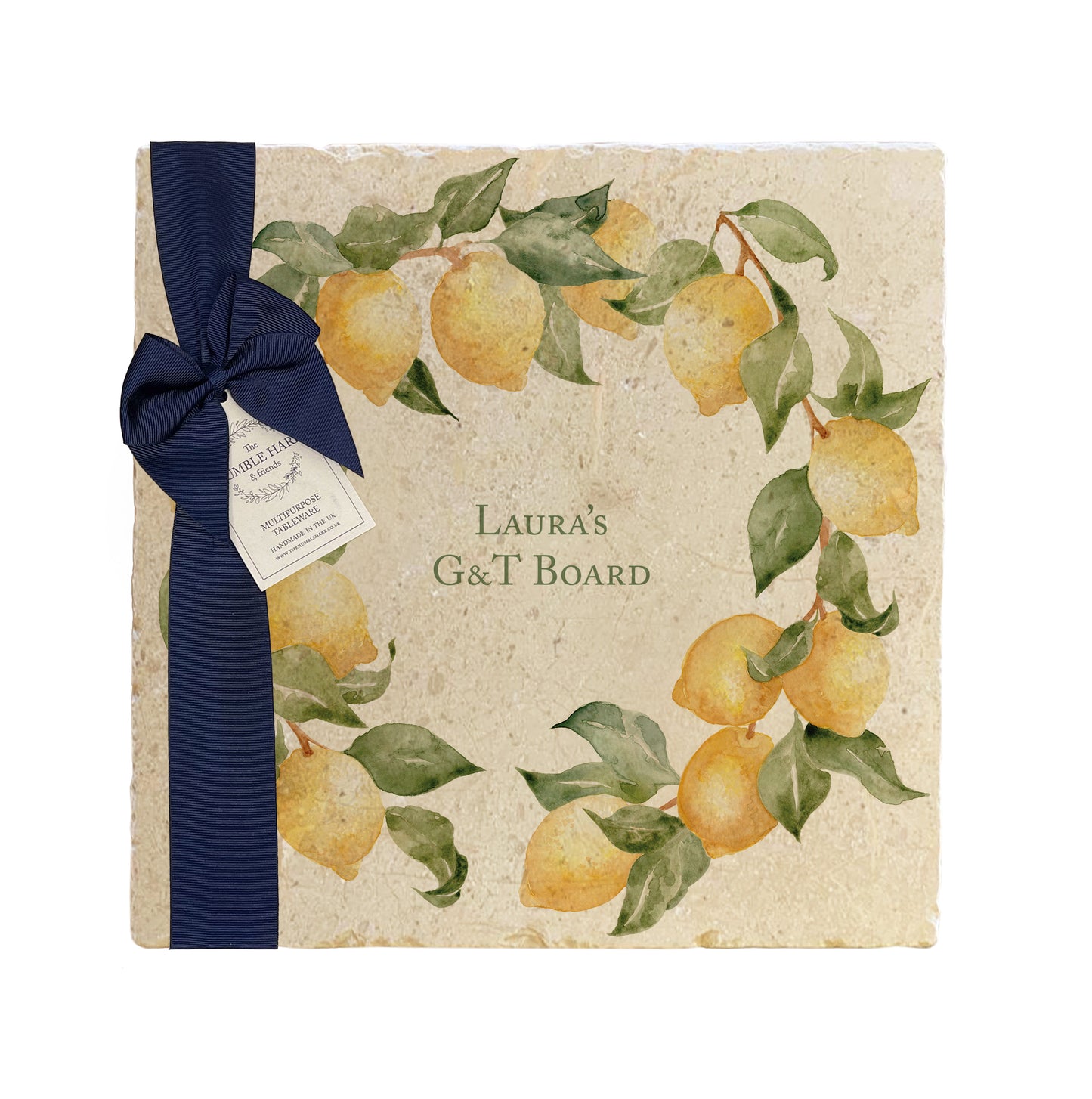 A personalised marble platter featuring a wreath of lemons and leaves, with a bespoke message in the centre of the design. The platter is packaged with a luxurious blue gift bow and tag.