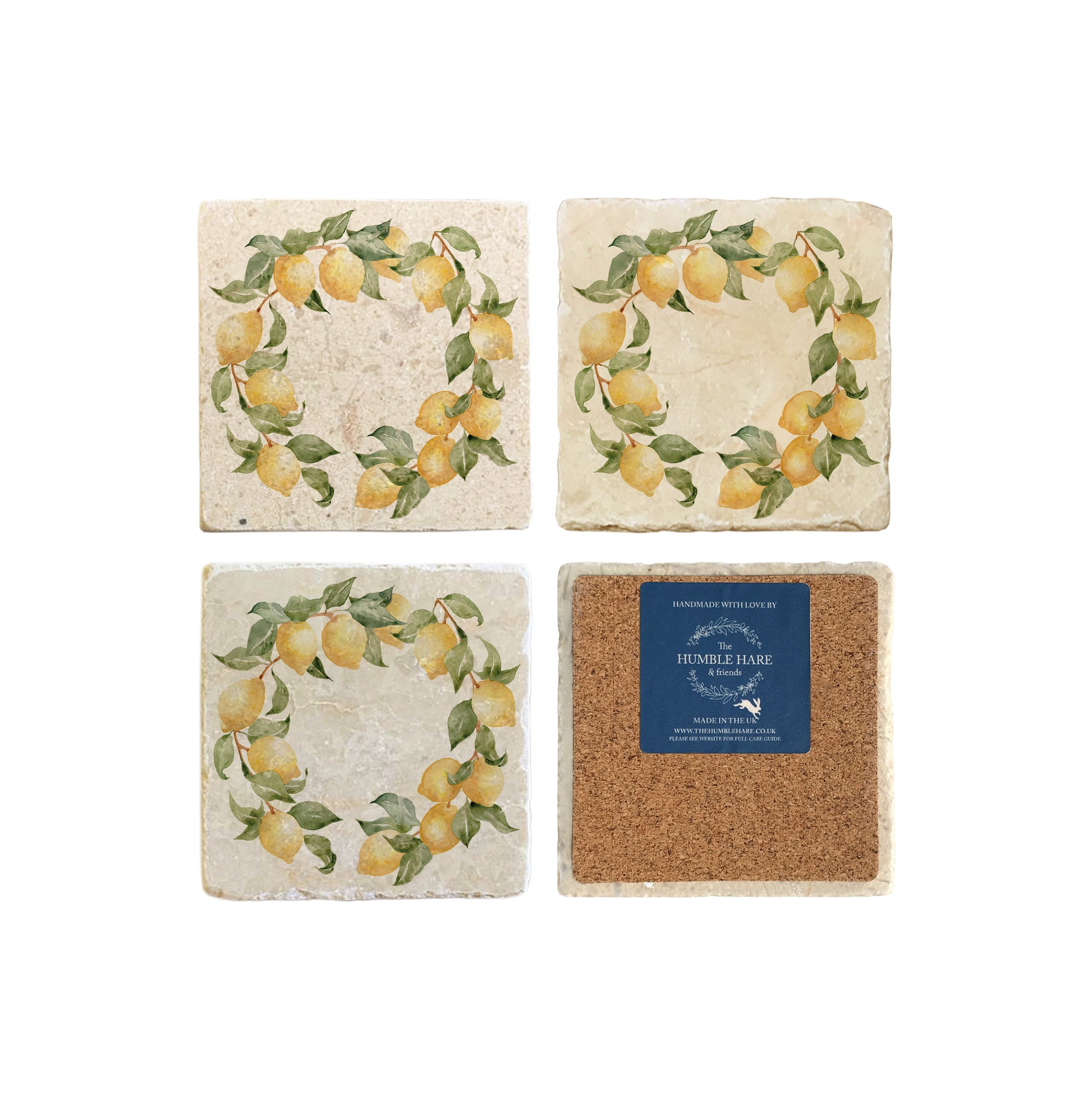 A set of 4 square marble coasters, featuring a watercolour lemon branch wreath design. One coaster is flipped to show that the coasters are backed with cork.