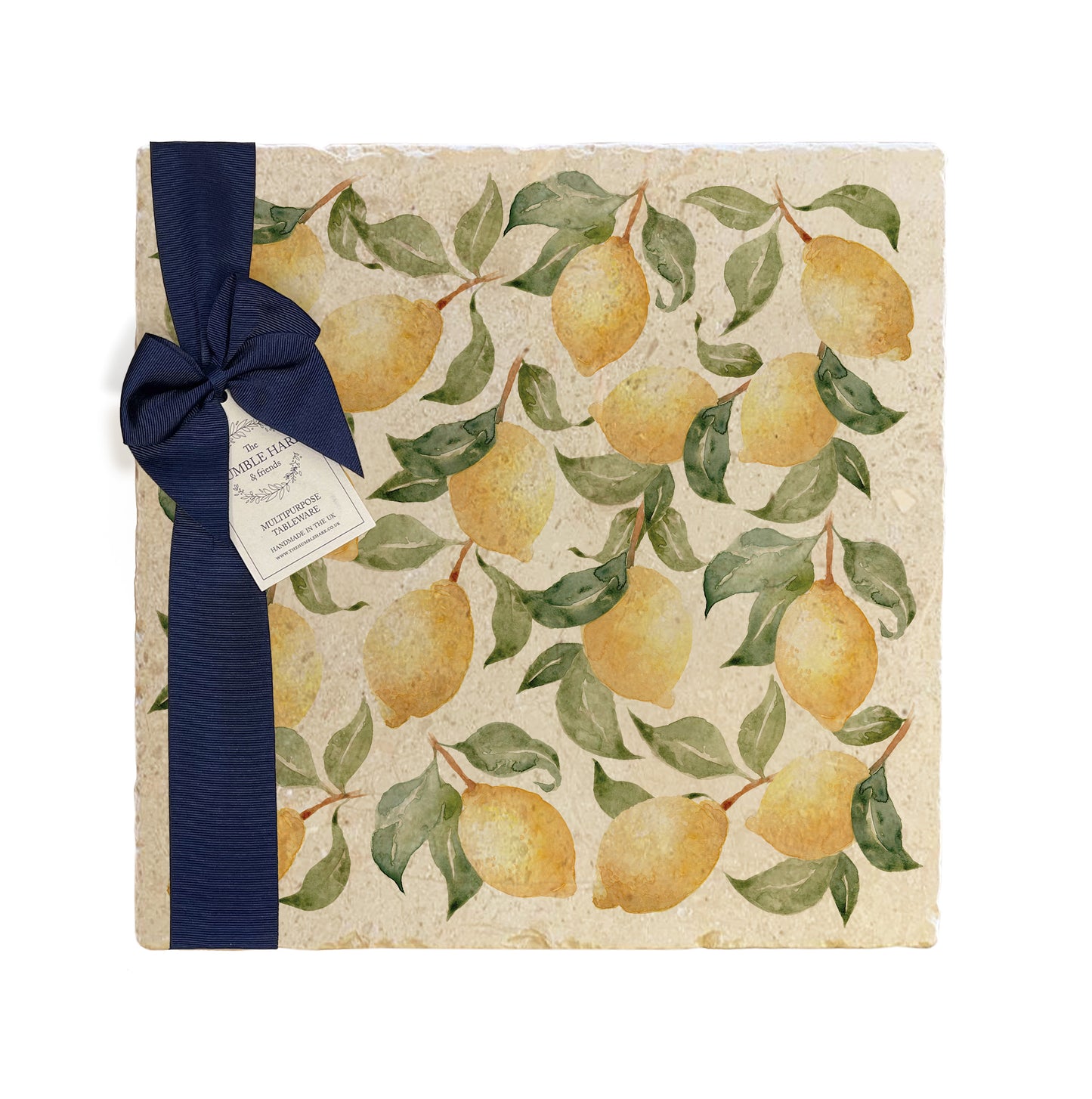 A large multipurpose marble platter with a watercolour lemon pattern, packaged with a luxurious dark blue bow and branded gift tag.