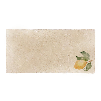 A cream marble 20x40cm wall tile with a minimalistic watercolour lemon design.