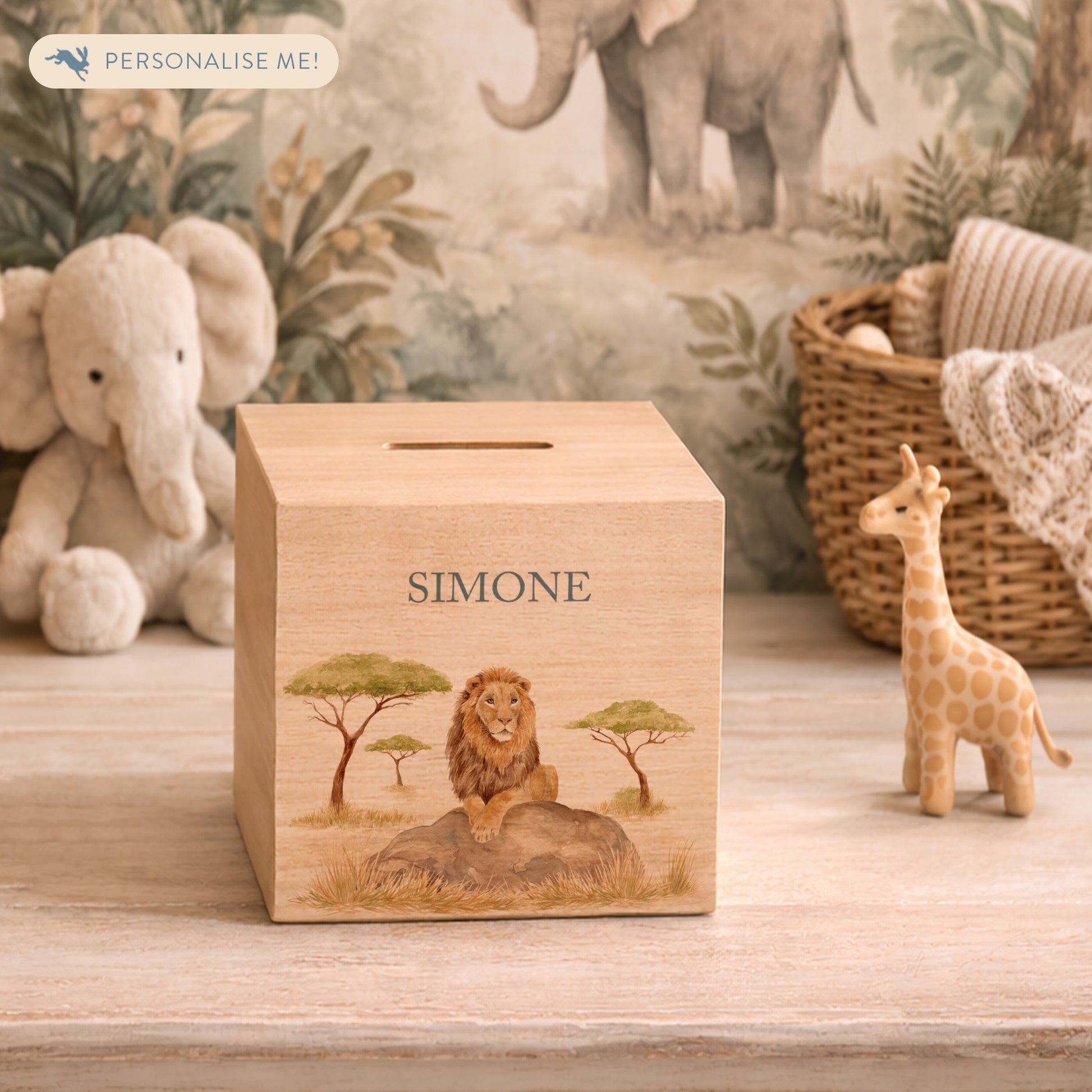 handmade wooden baby money box with watercolour animals in a nursery setting, This design features a majestic Lion sat on a rock in the Savannah. 