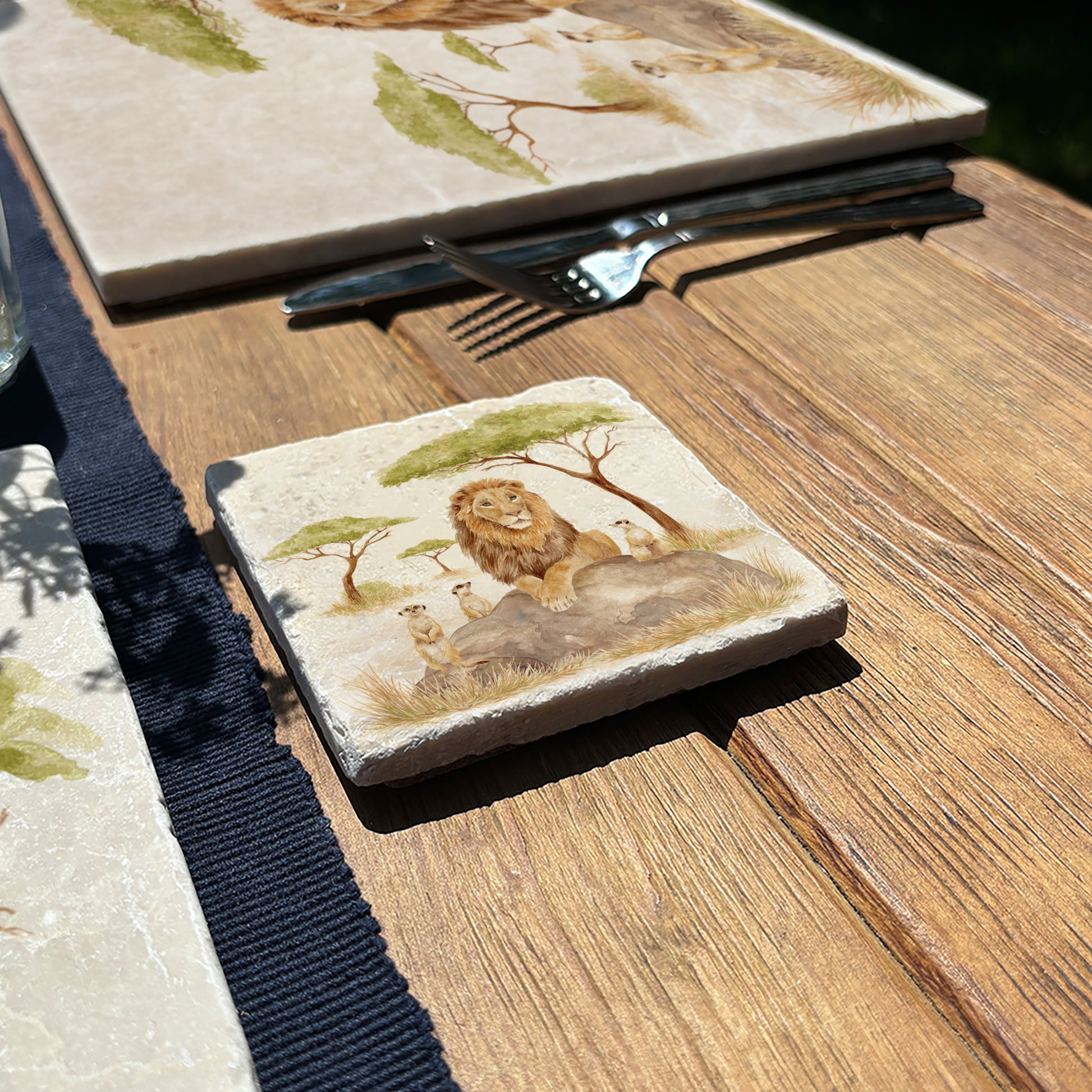 The Savannah Collectors set is perfect for the safari lover, featuring beautiful watercolour designs on our much loved marble platters and coasters. You can find a Lion and Meerkats on this set of 4 coasters