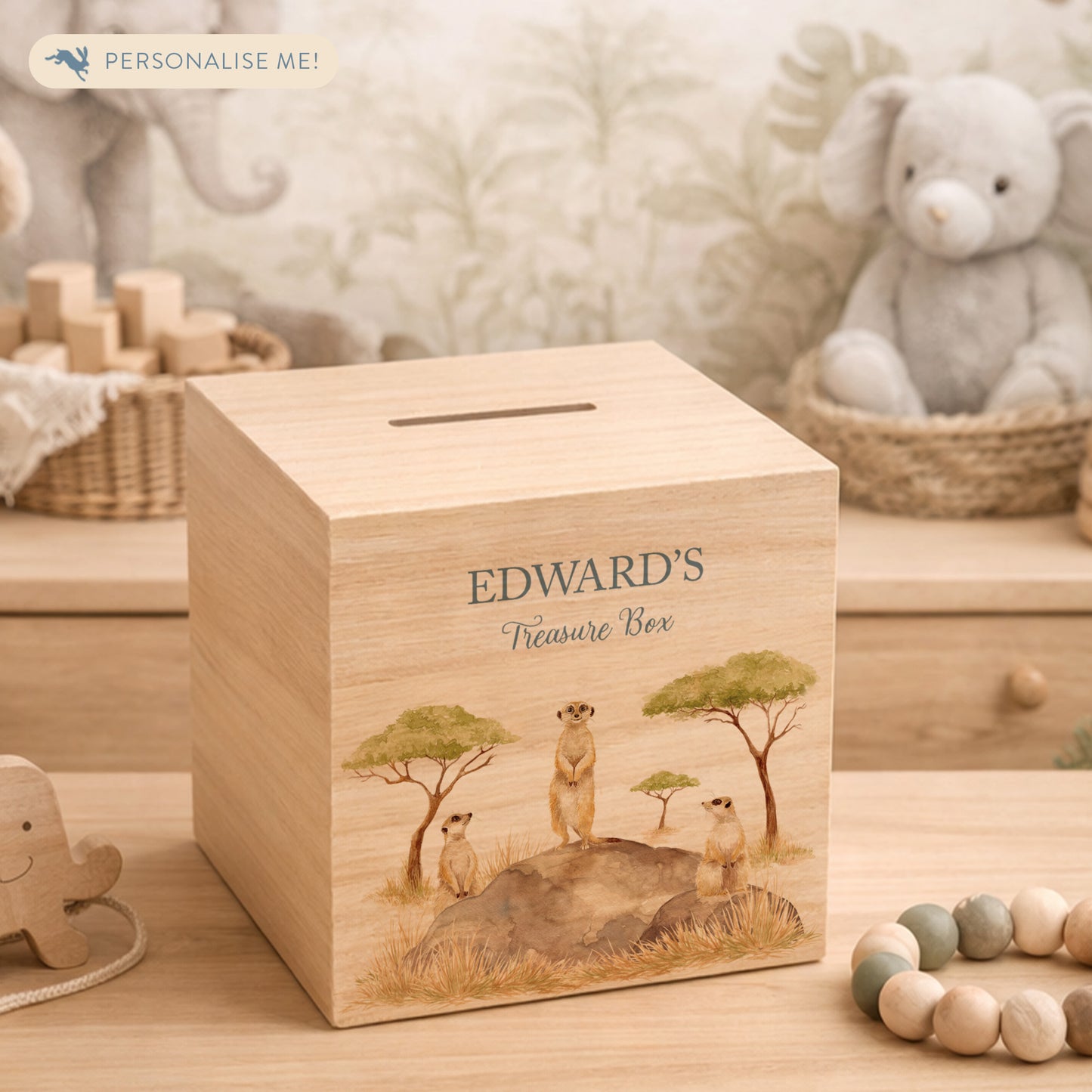 personalised handmade money box styled in nursery or childrens bedroom, This design features three happy meerkats sat on a rock. 