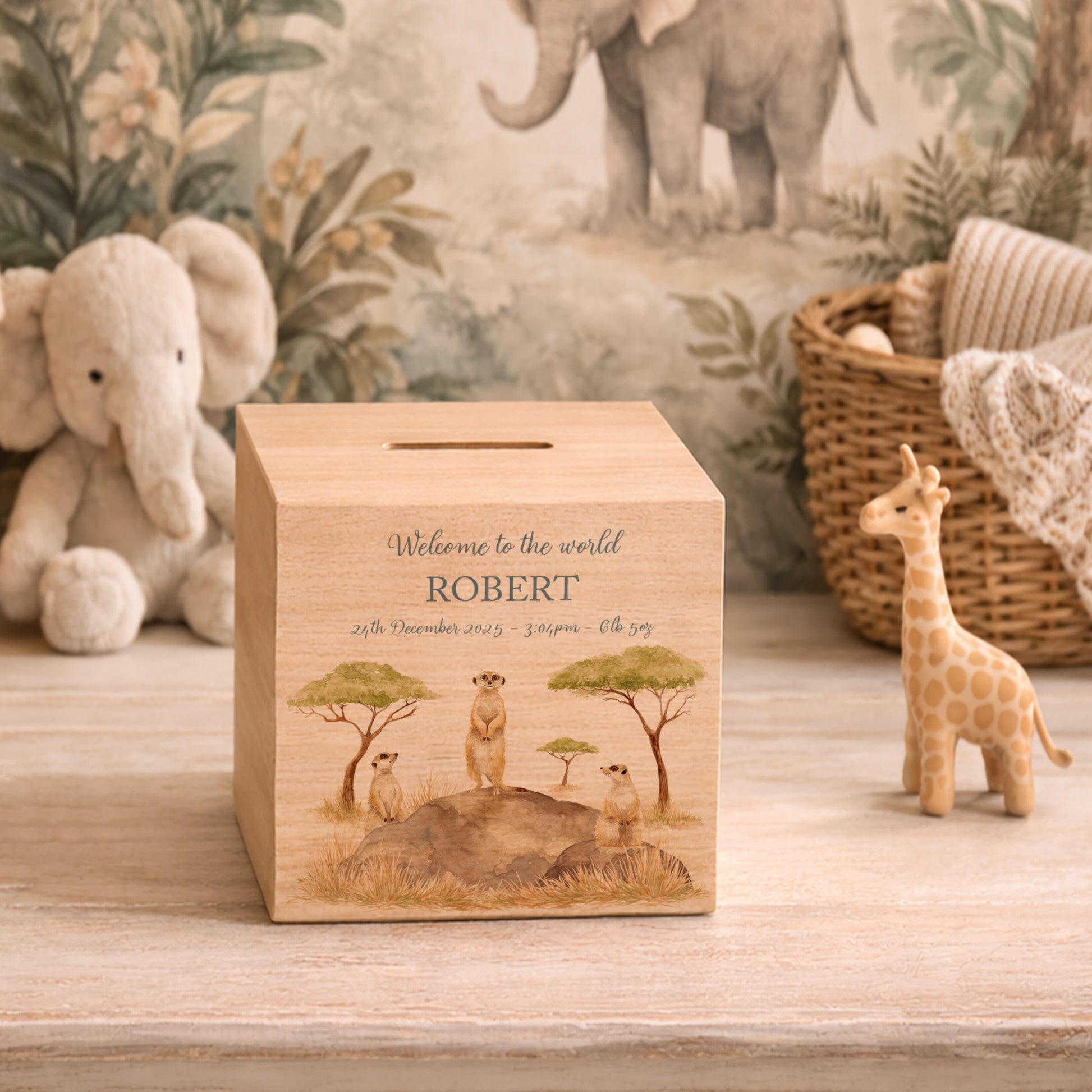 personalised handmade money box styled in nursery or childrens bedroom, This design features three happy meerkats sat on a rock. 