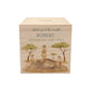 personalised handmade money box styled in nursery or childrens bedroom, This design features three happy meerkats sat on a rock. 
