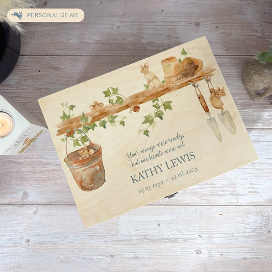 Wooden box with a decorative lid featuring animal illustrations on a wooden background. Perfect funeral memory keepsake box, for storing ashes, order of service, flowers, pictures. 