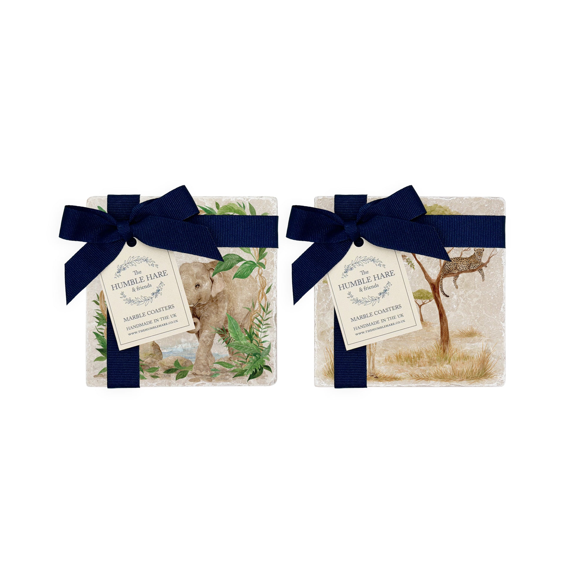 Set of four mix and match marble coasters with wild animal rainforest and savannah watercolour designs. The coasters have luxurious blue gift bows.