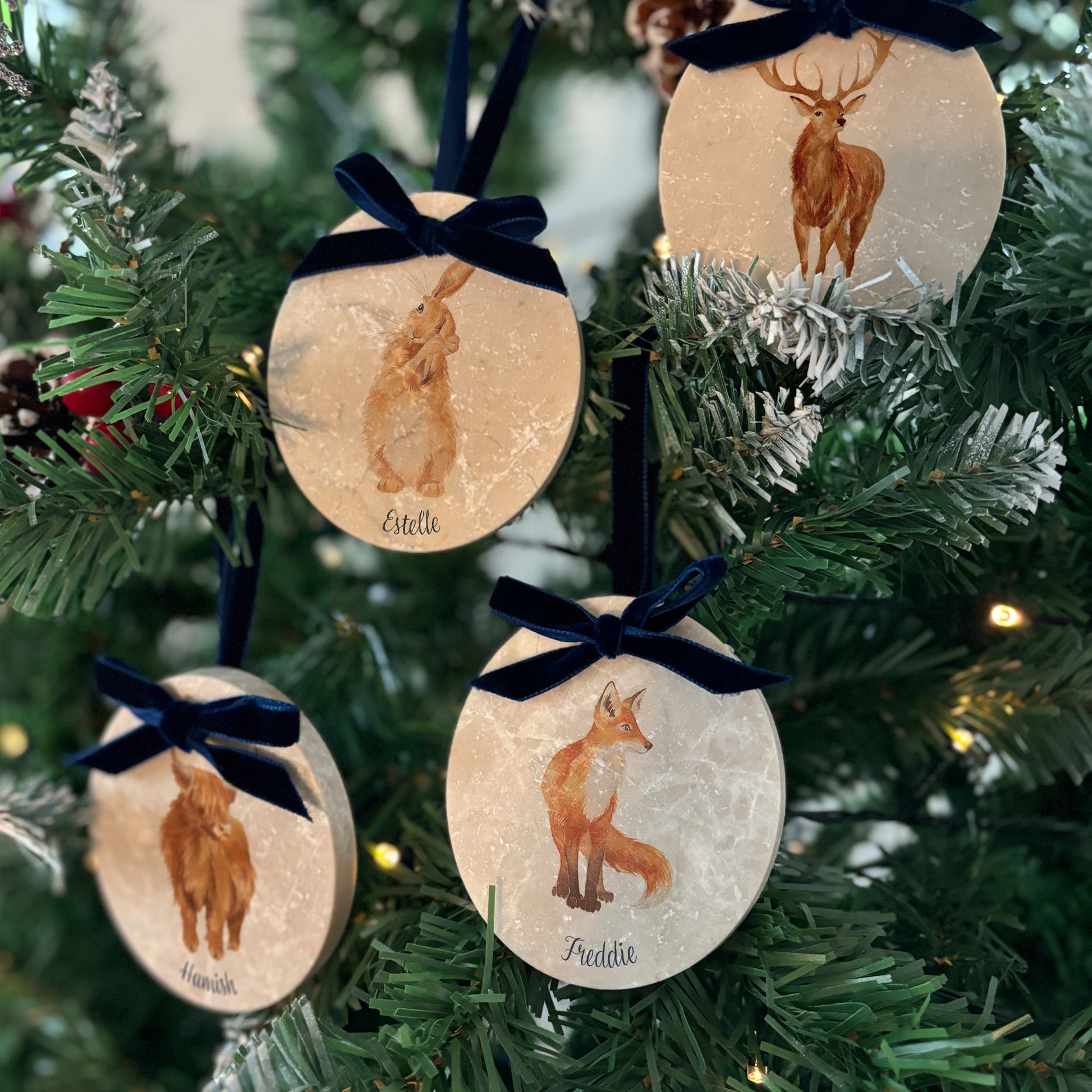 Capture the spirit of the great outdoors with our oval-shaped marble bauble sets, featuring delicate watercolour designs. Available with or without Christmas hats and finished with a velvet ribbon, these baubles can be personalised for a truly unique holiday decoration.