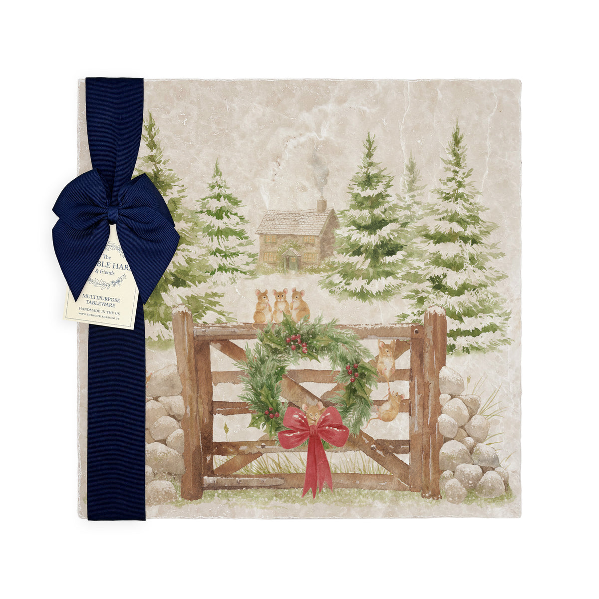 A large square marble platter with a watercolour winter forest scene featuring mice playing on the cottage gate. The platter is wrapped with a dark blue bow and paper tag.