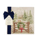 A square medium marble platter featuring a winter landscape watercolour illustration with snow-covered evergreen trees, a small cabin, mice playing on a wooden gate, a green wreath, and a red bow. The platter is wrapped in a dark blue bow with a paper tag.