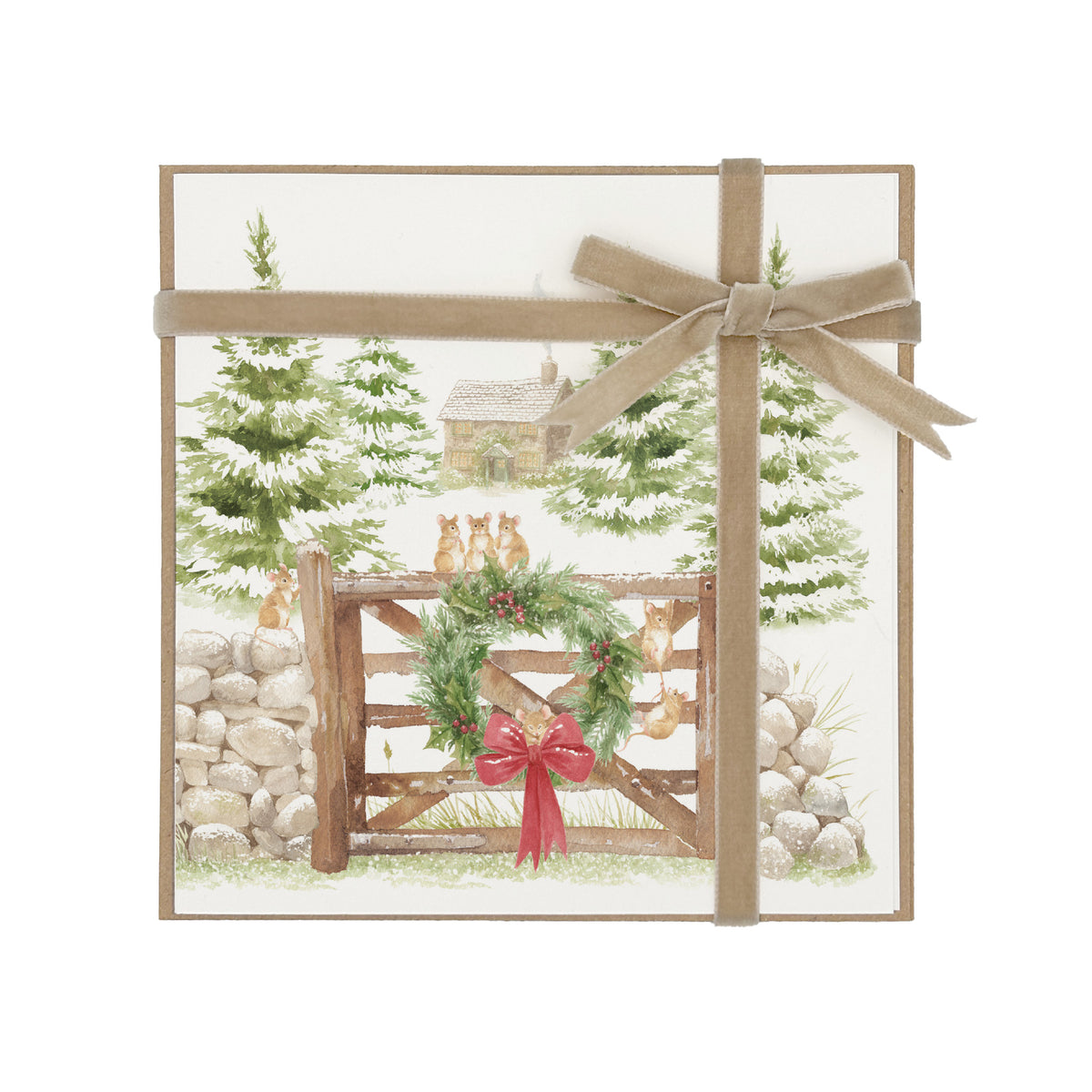 A pack of square greetings cards featuring a winter landscape scene with evergreen trees, a rustic cabin, a wooden fence, a green wreath with red berries, and small foxes. The pack of 6 or 12 cards is wrapped with a champagne gold ribbon and bow, shown on a plain white background.