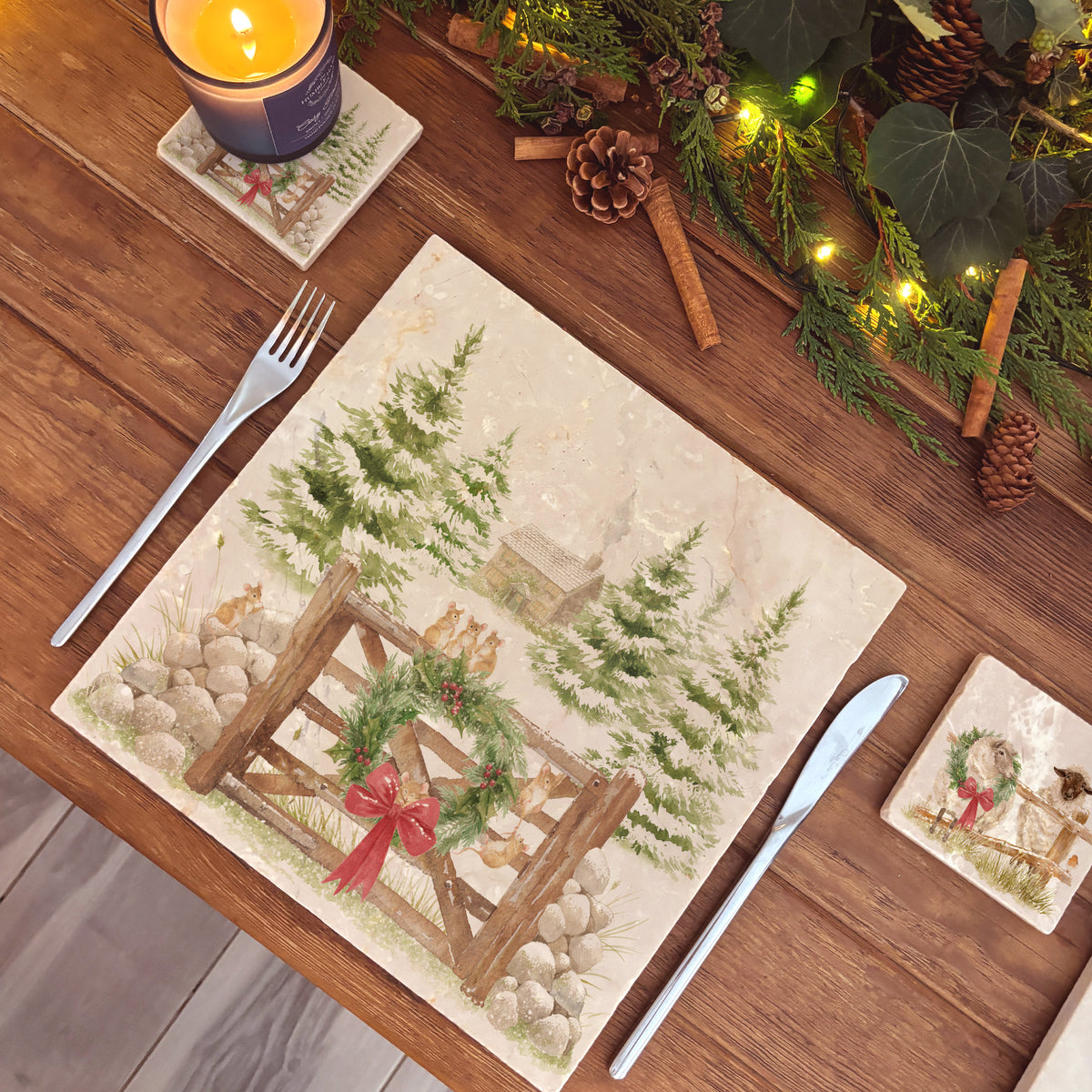 A large square marble platter with a watercolour winter forest scene featuring mice playing on the cottage gate. 
