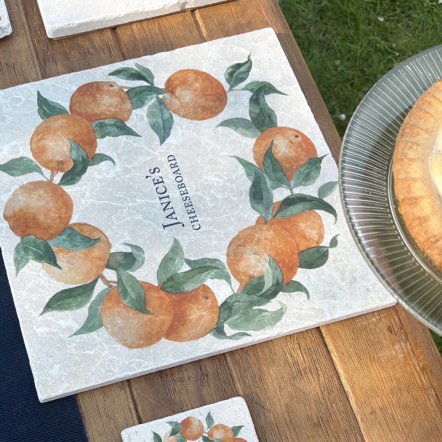 A personalised marble large platter with an orange wreath watercolour design. Create a personalised placemat, serving platter, trivet or cheeseboard as a luxury gift.
