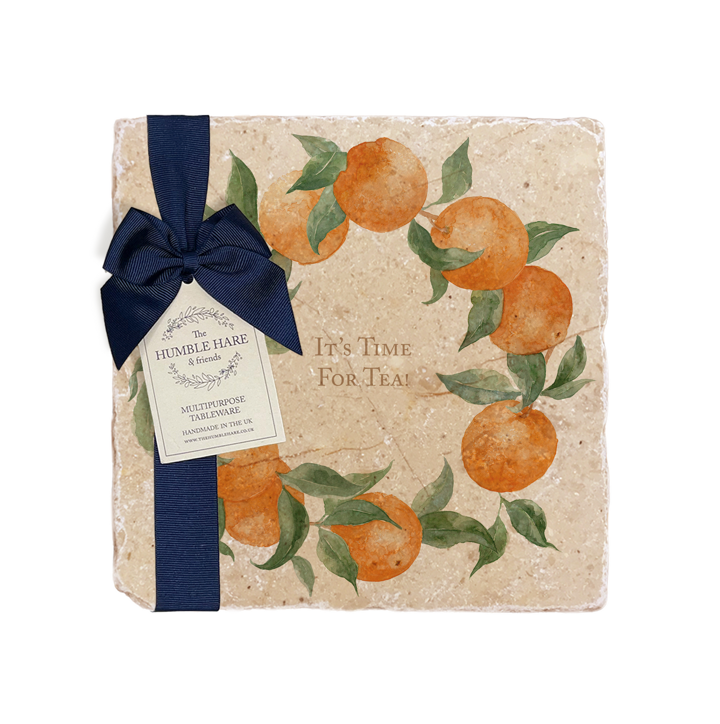 A personalised marble platter featuring a wreath of oranges and leaves, with a bespoke message in the centre of the design. The platter is packaged with a luxurious blue gift bow and tag.