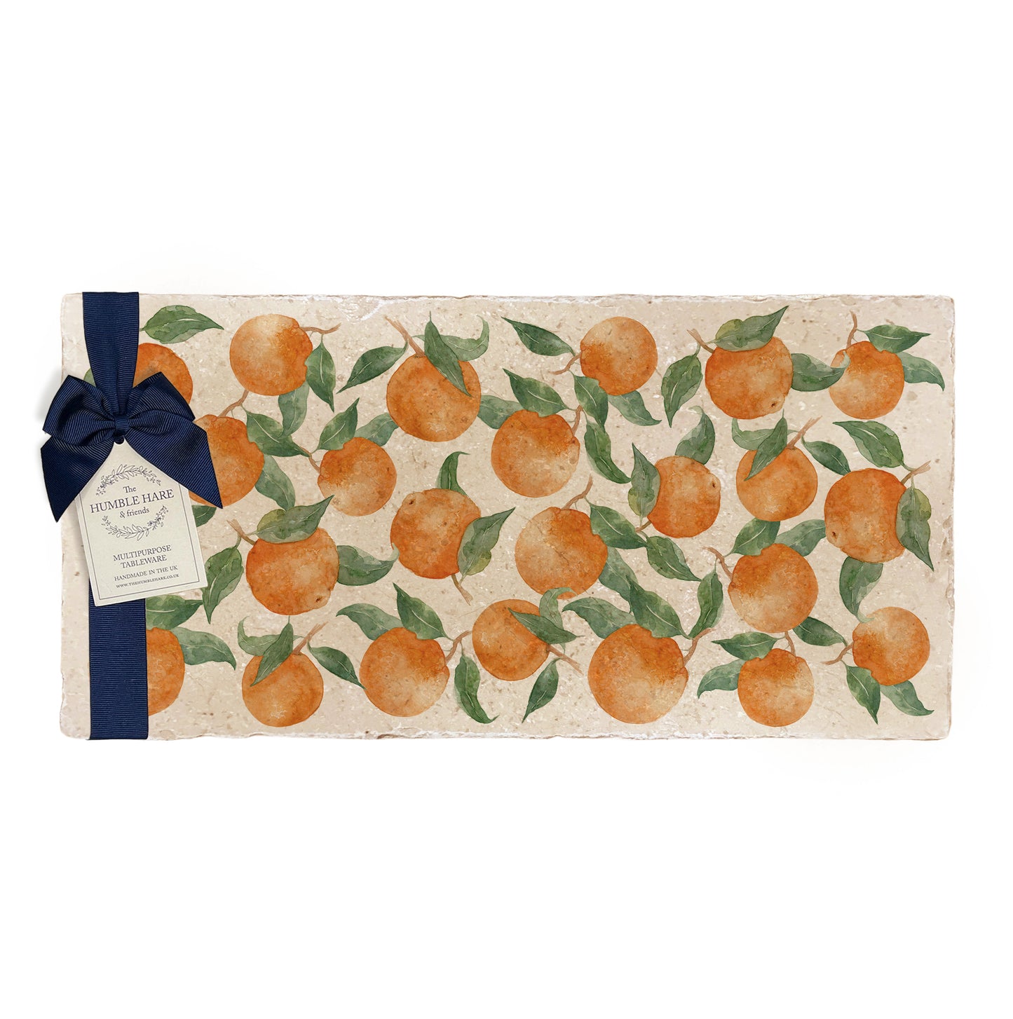 A multipurpose marble sharing platter with a watercolour orange pattern, packaged with a luxurious dark blue bow and branded gift tag.