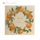 A large marble platter featuring a wreath of oranges and leaves, personalised with bespoke names in the centre of the platter in a neutral font.