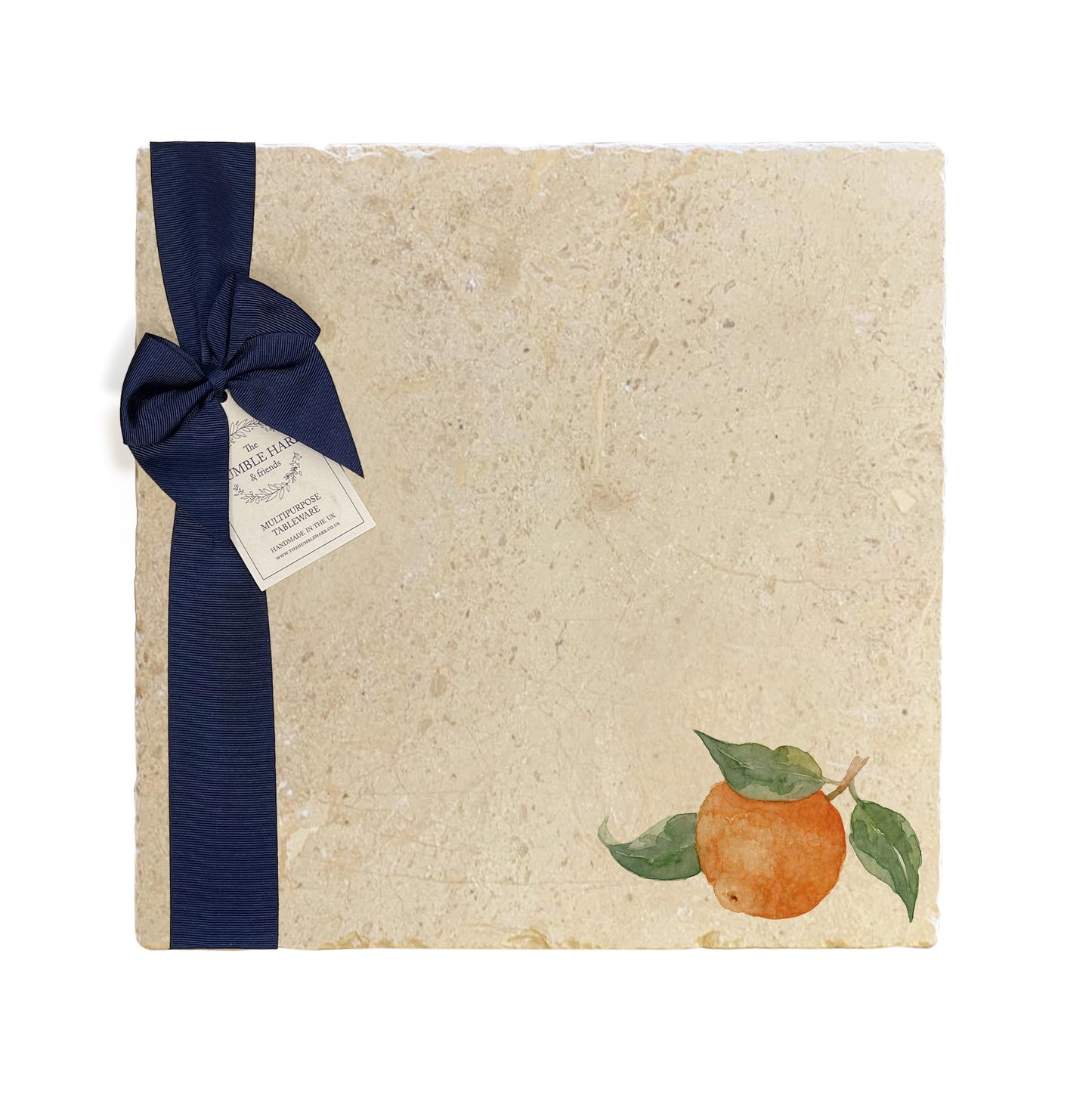 A large multipurpose marble platter with a watercolour orange design, packaged with a luxurious dark blue bow and branded gift tag.