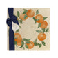 A large multipurpose marble platter with a watercolour orange wreath design, packaged with a luxurious dark blue bow and branded gift tag.