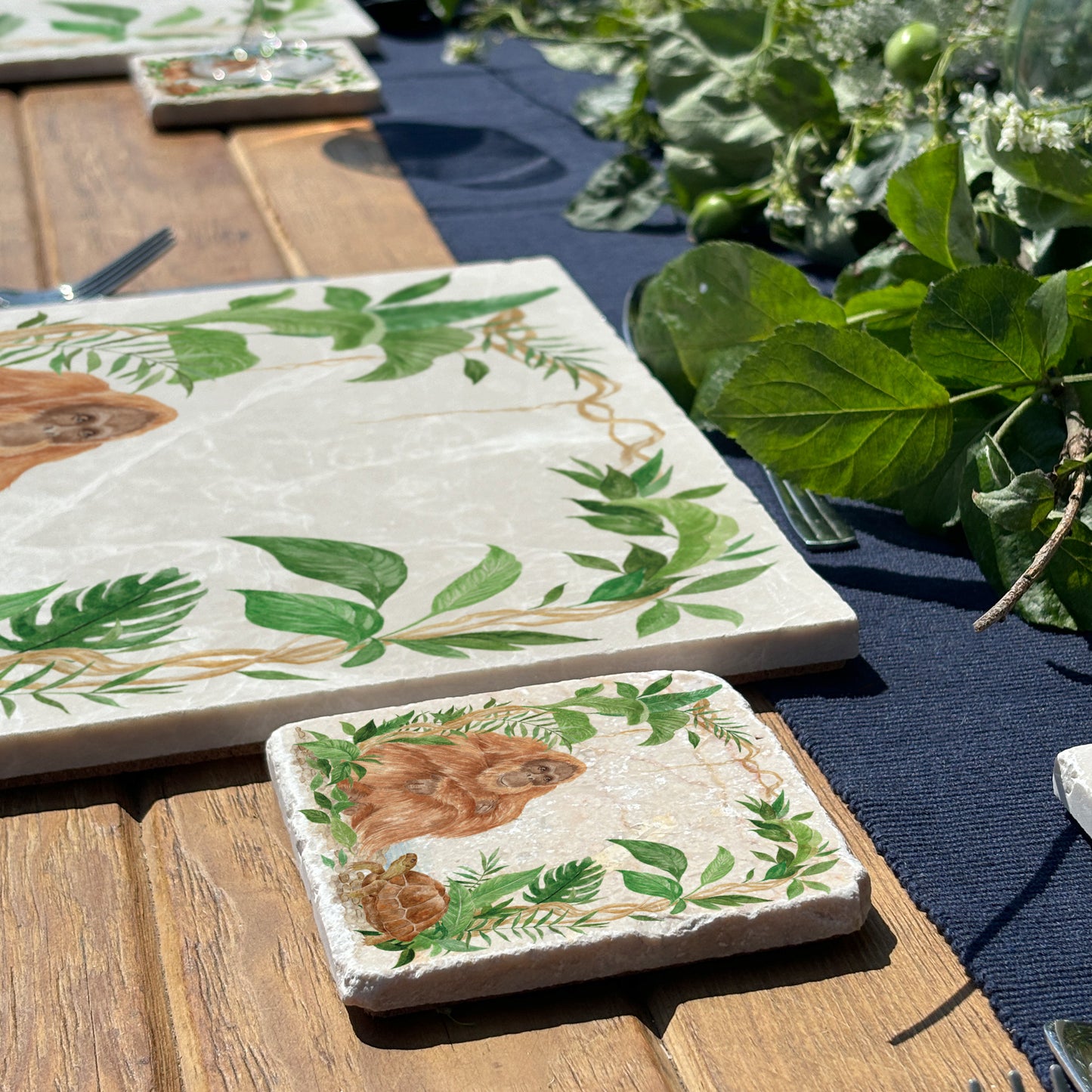 Welcoming our Rainforest Design, surrounded by the rainforest leaves and vines. Our Orangutan and Tortoise sitting a quiet corner of the rainforest. Illustrated in our  original watercolour designs on our set of 4 Coasters. 