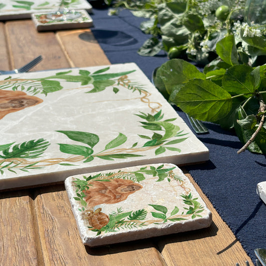 Welcoming our Rainforest Design, surrounded by the rainforest leaves and vines. Our Orangutan and Tortoise sitting a quiet corner of the rainforest. Illustrated in our  original watercolour designs on our set of 4 Coasters. 