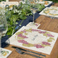 A beautiful garden table set with personalised marble placemats and coasters, ready for a dinner party. The placemats have a mix of fruit designs.
