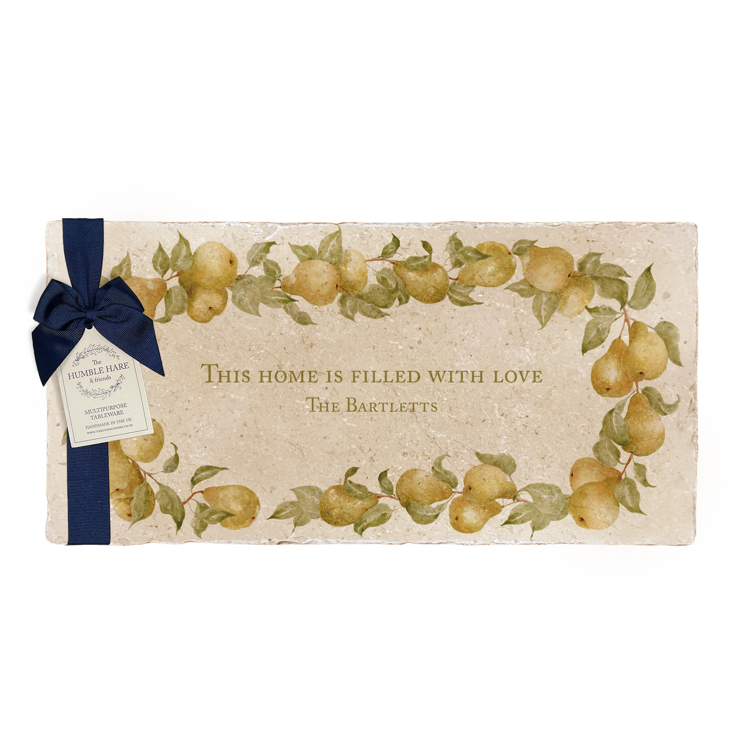 A personalised marble sharing platter featuring a wreath of pears and leaves, with a bespoke message in the centre of the design. The platter is packaged with a luxurious blue gift bow and tag.