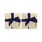 A set of 4 handmade marble coasters featuring a single watercolour pear, packaged in 2 pairs, with a luxurious blue bow and gift tag.