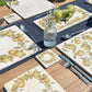 A square marble coaster on an al fresco dining table set for a fancy dinner party. The marble platters and coasters feature a watercolour pear wreath.