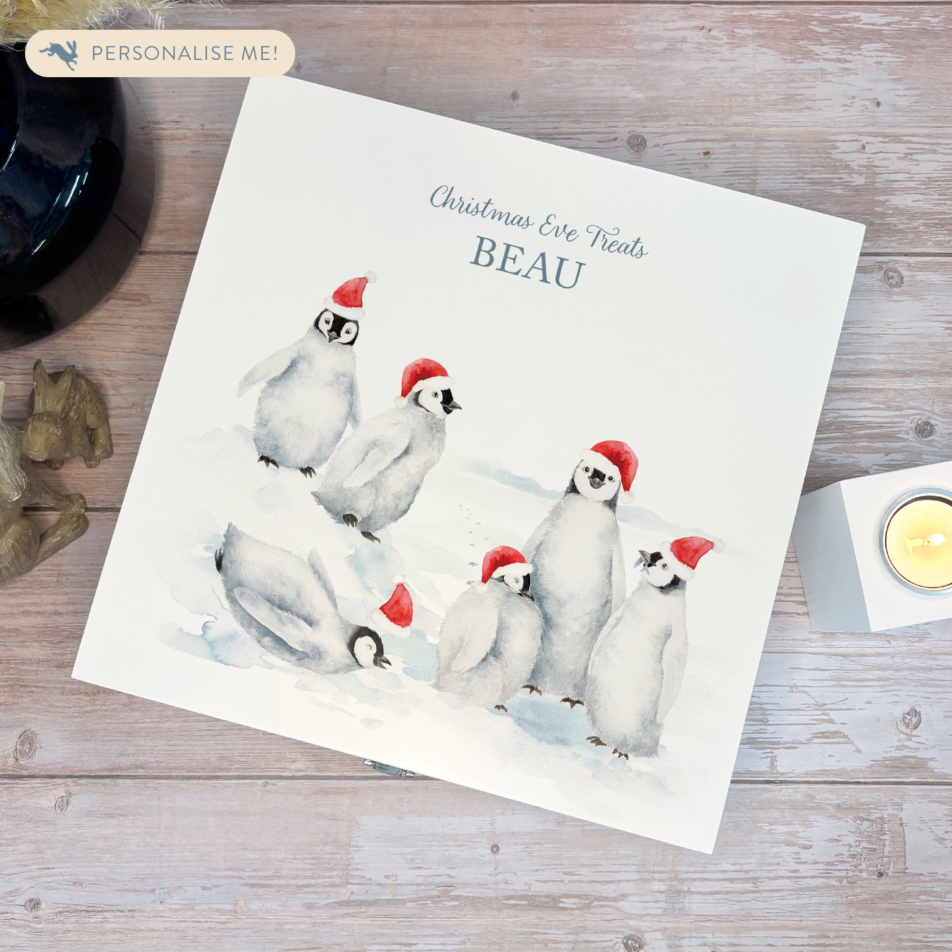 White Wooden Christmas Eve box, perfect for Christmas sweets and treats. A great Keepsake box with penguins and Santa's hats ready to enjoy the Christmas festivities. 