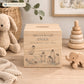 handmade nursery keepsake money box with delicate watercolour design, a group of Penguins playing, slipping and sliding in the snow. 