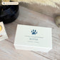 A beautifully crafted solid wooden urn, finished in white with a soft watercolour design of your cat or dogs paw print, Thoughtfully made for either display or burial, this personalised urn can be customised to create a meaningful memorial. Perfect for holding ashes of a beloved pet, it serves as a comforting tribute and keepsake.