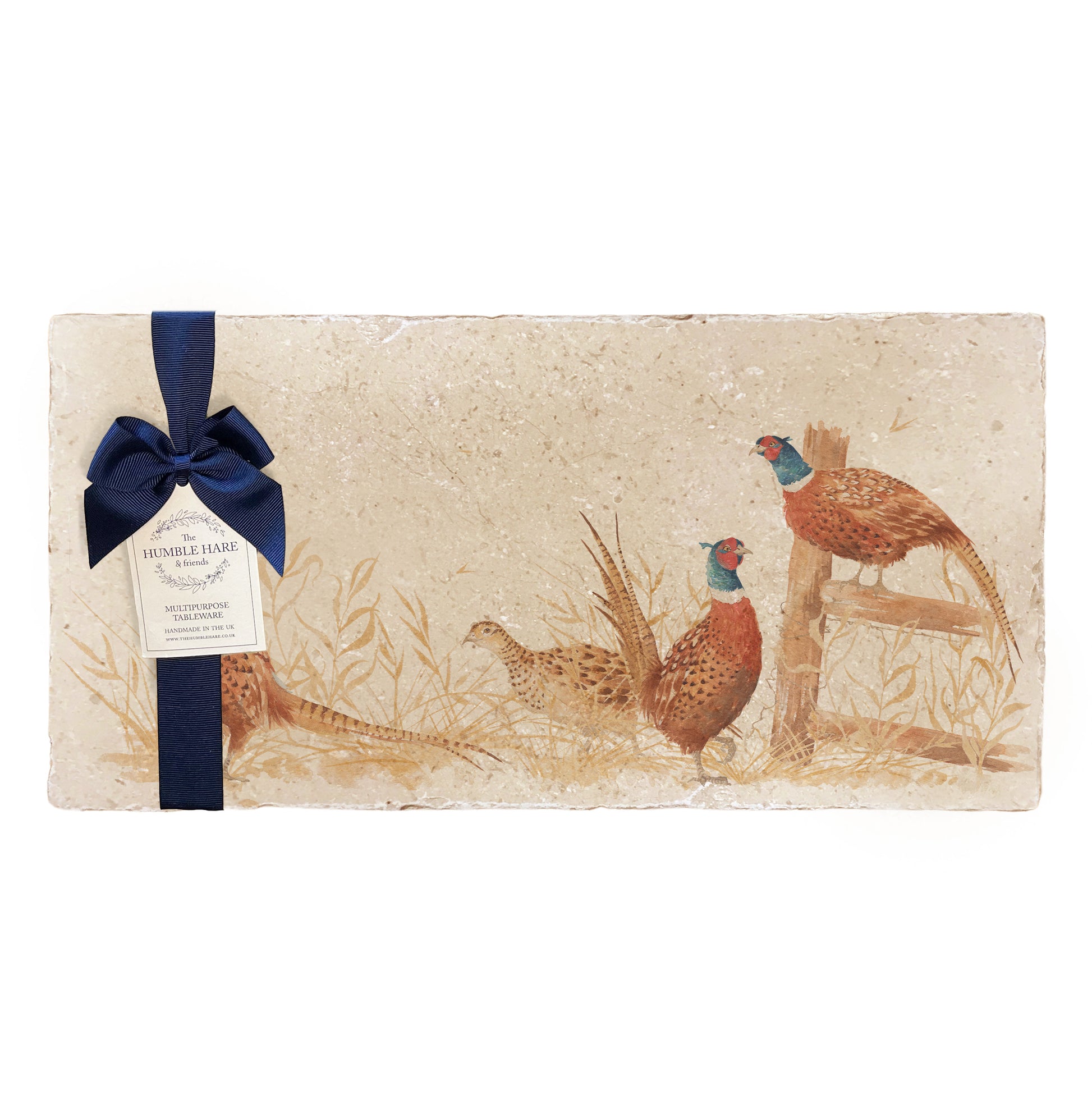 A multipurpose marble sharing platter with a watercolour pheasant design, packaged with a luxurious dark blue bow and branded gift tag.