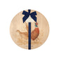 Round beech wood chopping board featuring a watercolour design of pheasants in the countryside. The wooden board is finished with a blue gift ribbon and tag.