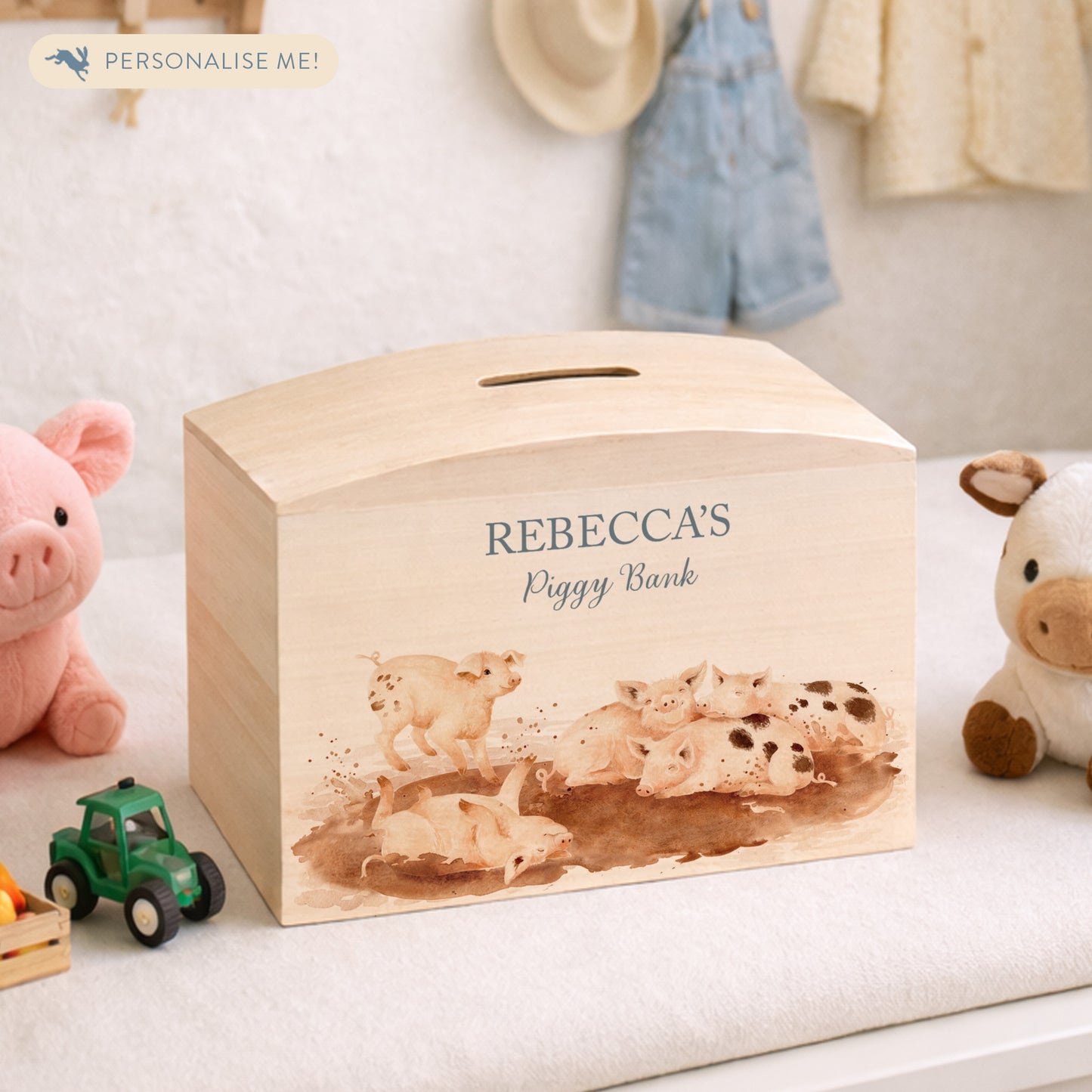 handmade wooden money box with watercolour design in nursery setting