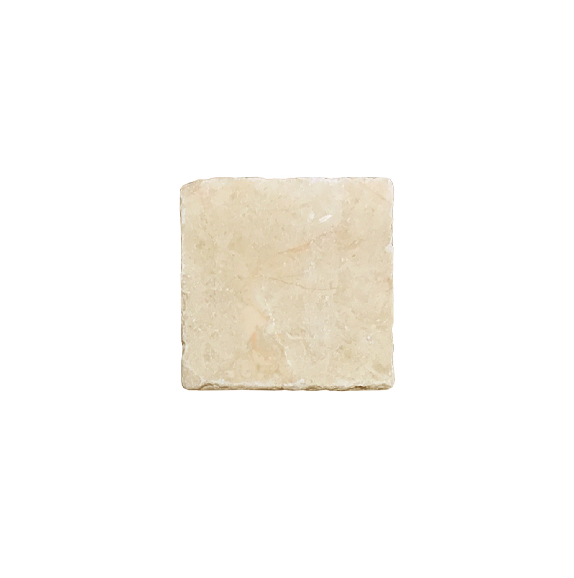 A small square cream marble tile.