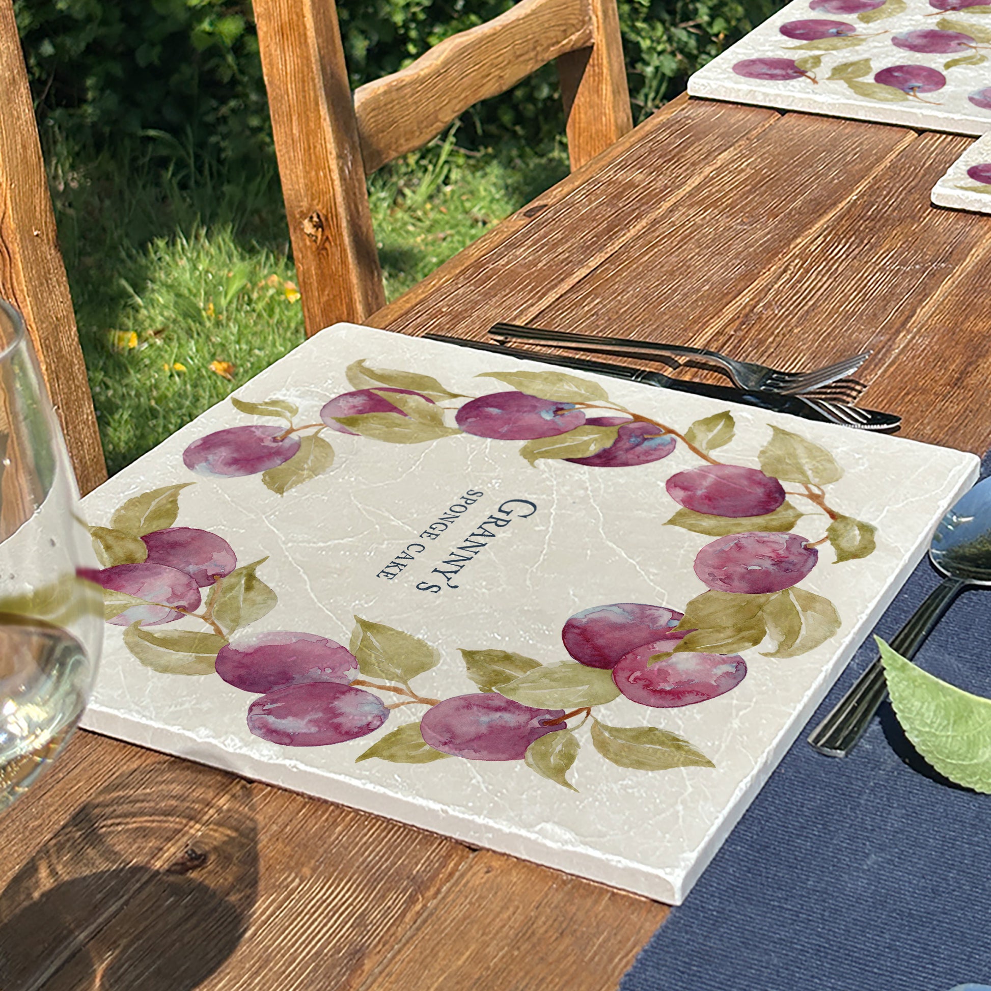 A personalised marble large platter with a plum wreath watercolour design. Create a personalised placemat, serving platter, trivet or cheeseboard as a luxury gift.