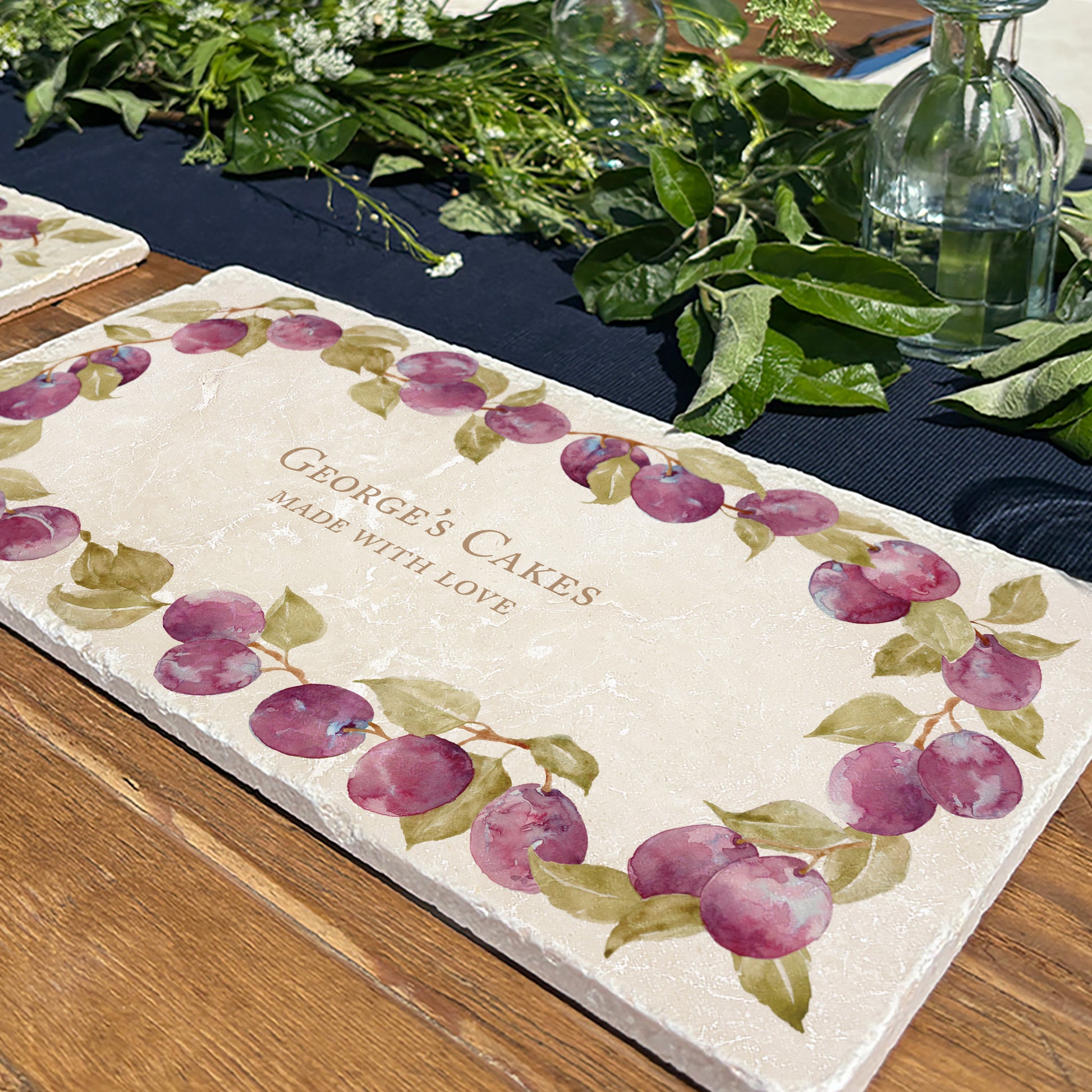 A personalised marble sharing platter with a plum wreath watercolour design. Create a personalised serving platter, trivet or cheeseboard as a luxury gift.