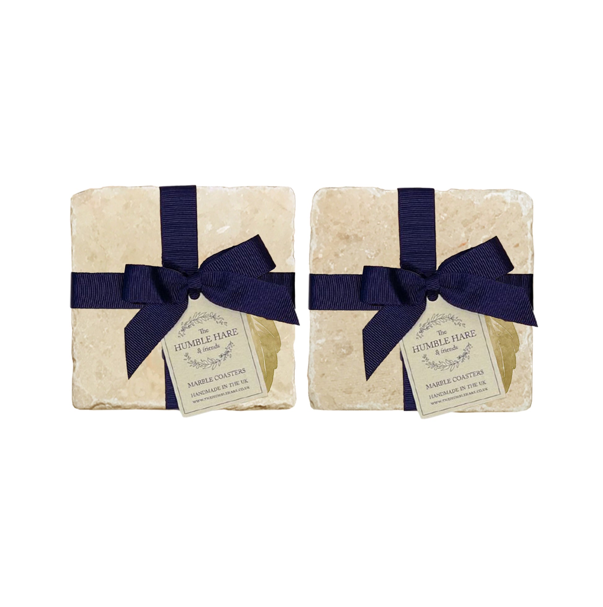 A set of 4 handmade marble coasters featuring a single watercolour plum, packaged in 2 pairs, with a luxurious blue bow and gift tag.